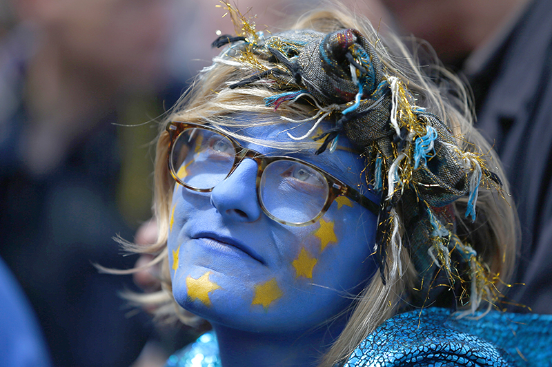 A woman wears paint on her face during a demonstration against Britain's decision to leave the European Union, in central London