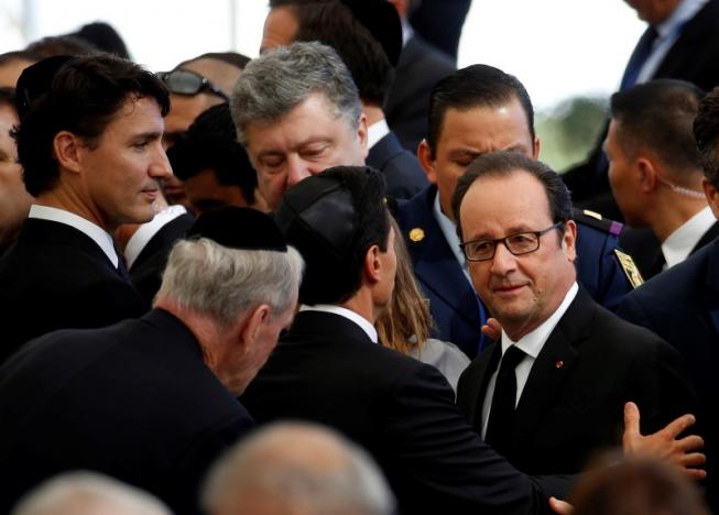 French President Francois Hollande and Canada's Prime Minister Justin Trudeau are seen upon their arrival to attend the funeral of former Israeli President Shimon Peres at Mount Herzl cemetery in Jerusalem