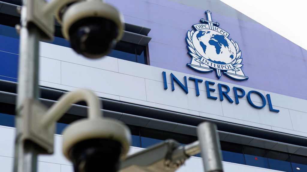 epa04703664 Security cameras pictured against the Interpol logo on the Interpol Global Complex for Innovation building (IGCI) in Singapore, 14 April 2015. Interpol's first digital crime centre was officially opened in Singapore on 13 April 2015. Complementing its headquarters in Lyon, the Interpol Global Complex for Innovation (ICGI) will support international policing efforts against cybercrime, as well as research and capacity building in online security. EPA/WALLACE WOON